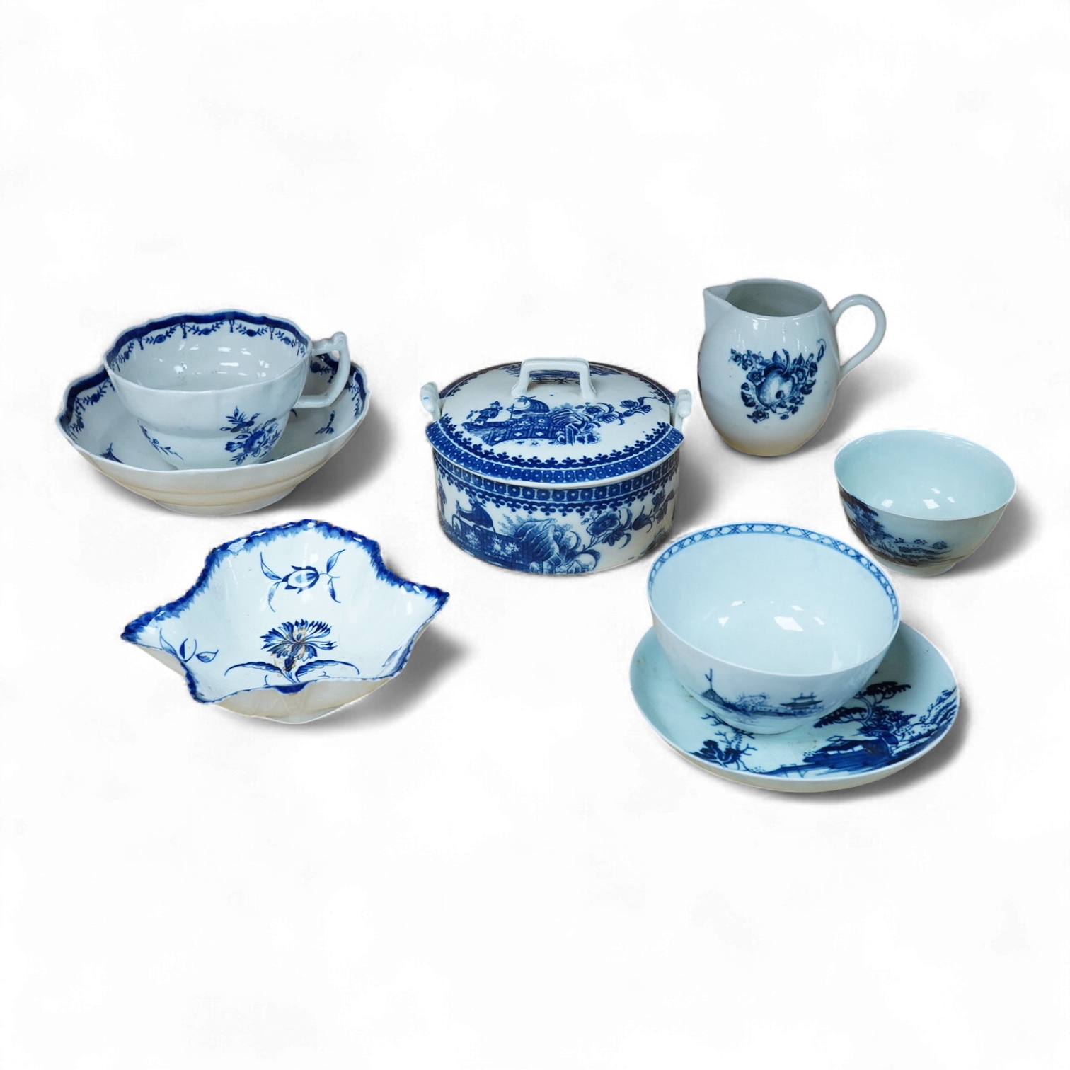 A group of 18th century Worcester and Liverpool porcelain teaware and a Caughley Cormorant fisherman butter tub and cover.